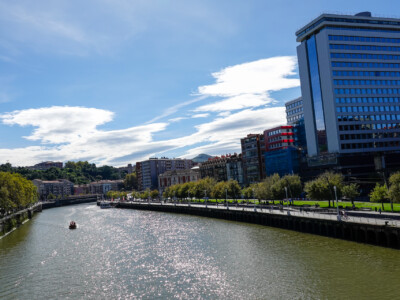 Clouds above the Nervión River waterfront walkway, Bilbao, Spain, 2024