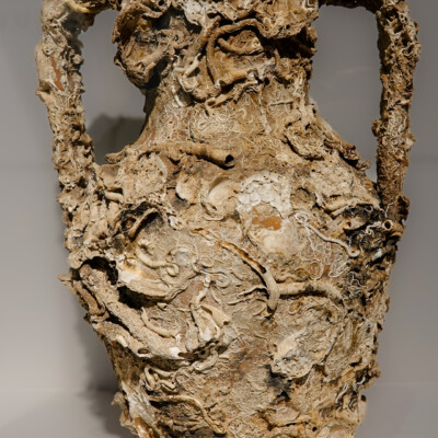 A Roman amphora underwater since some time around 200-400 CE, covered with centuries of sea life. The only flaw was in the rim, repaired using traditional Kintsugi techniques by Nakao Fukumaru.